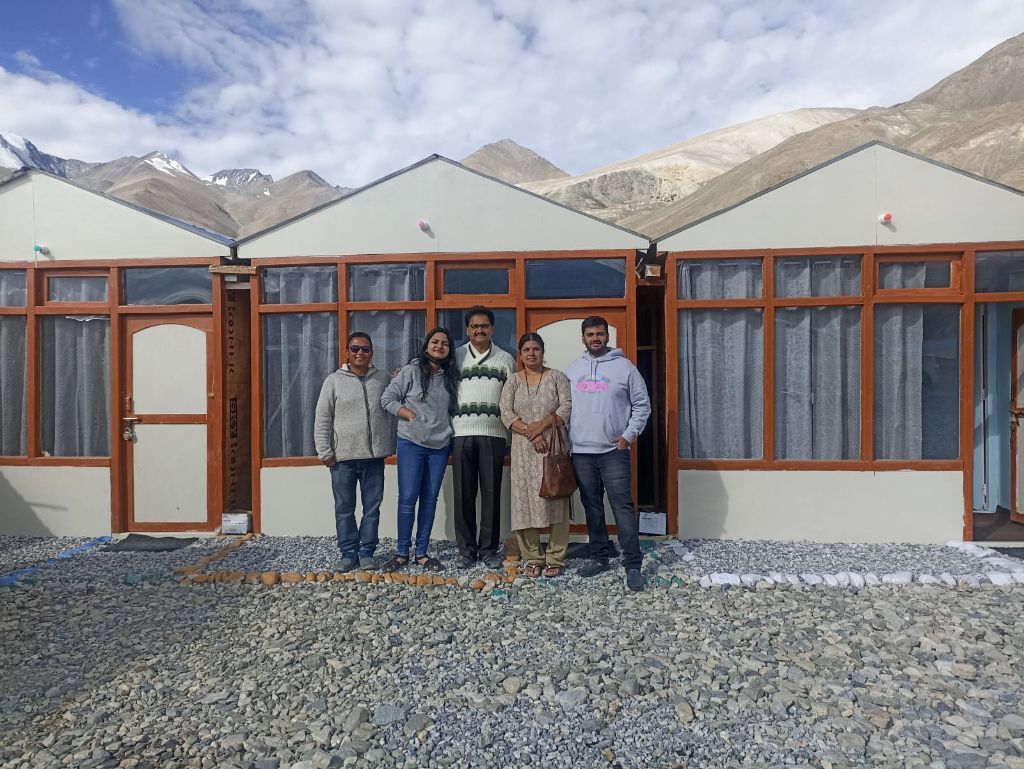 Cottage with mountain backdrop