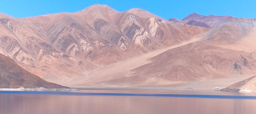 Sandy pink mountains above the lake