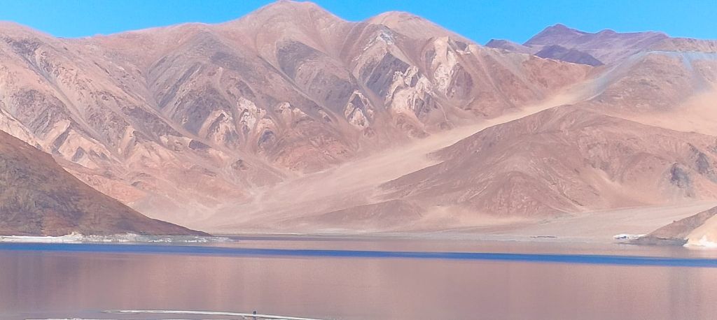 Sandy mountains and pink lake